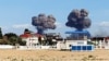 UKRAINE – Smoke from explosions at the military airfield in the village of Novofedorivka near the city of Saky in occupied Crimea, August 9, 2022